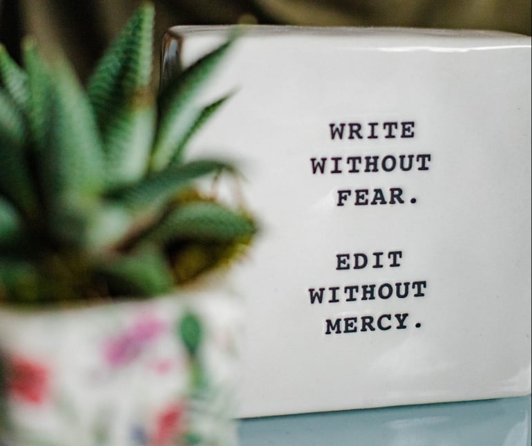 Image of a tablet saying write without fear, edit without mercy - 3 storytelling copywriting examples - Copify blog