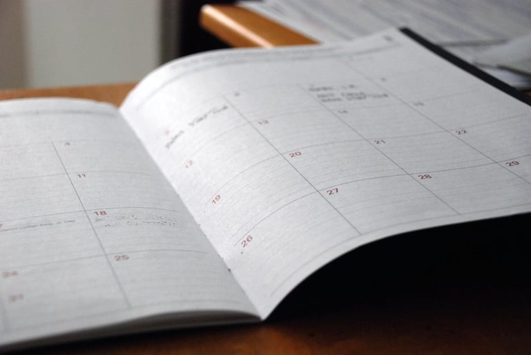 Closeup on an open planner - How to put together an editorial calendar for content marketing - Copify blog 