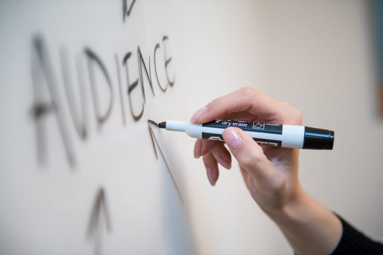 Image of someone writing 'audience' on a whiteboard - How to start an inbound marketing campaign - Copify blog