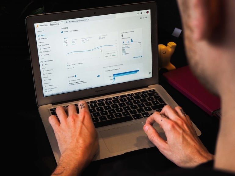 Image of someone accessing analytics on a laptop - What does CTR stand for in marketing - Copify blog