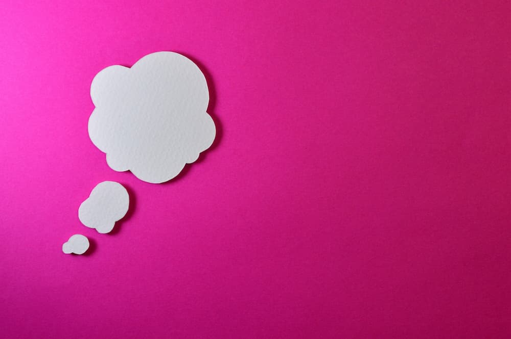 Thought bubble on pink background - Content idea generator tools - Copify blog