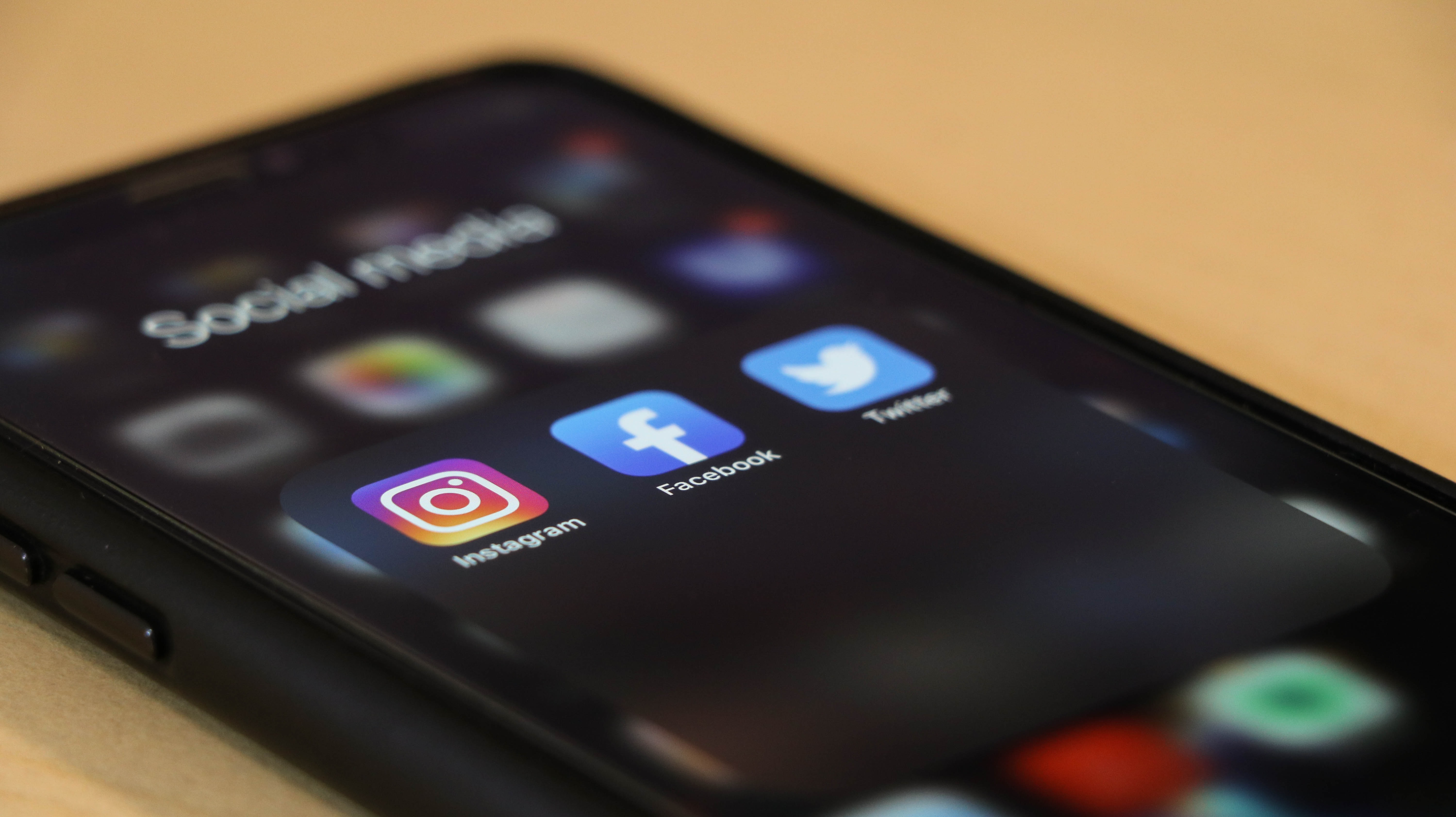 App icons on a smartphone - Does social media marketing work in the B2B marketplace? - Copify blog