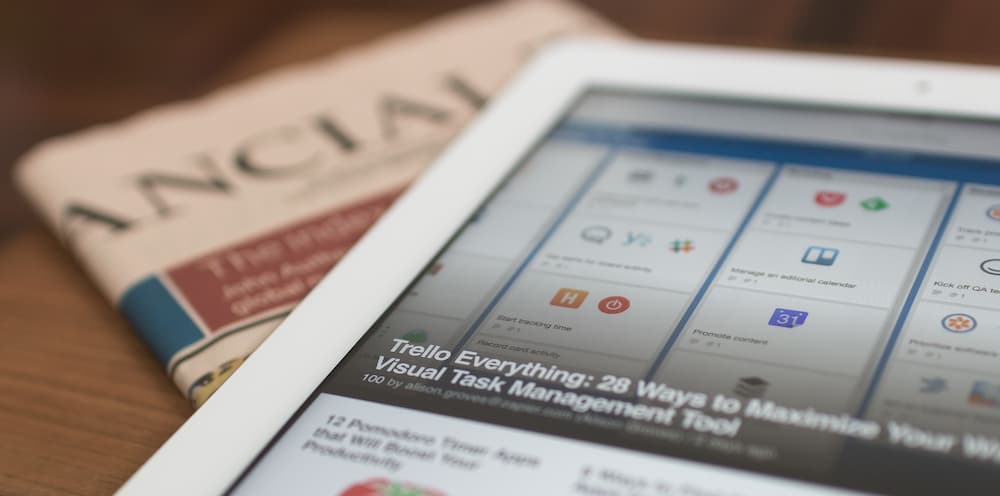 Image of newspaper and tablet - What are the different types of media writing? - Copify blog
