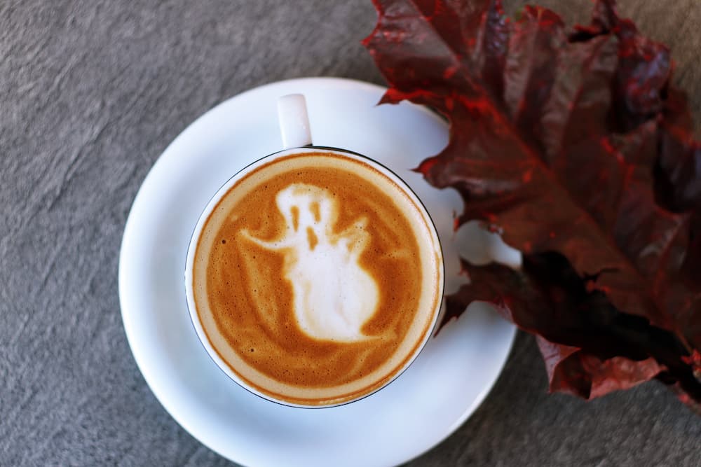 Cup of coffee with ghost in the foam - What is ghost blogging - Copify blog