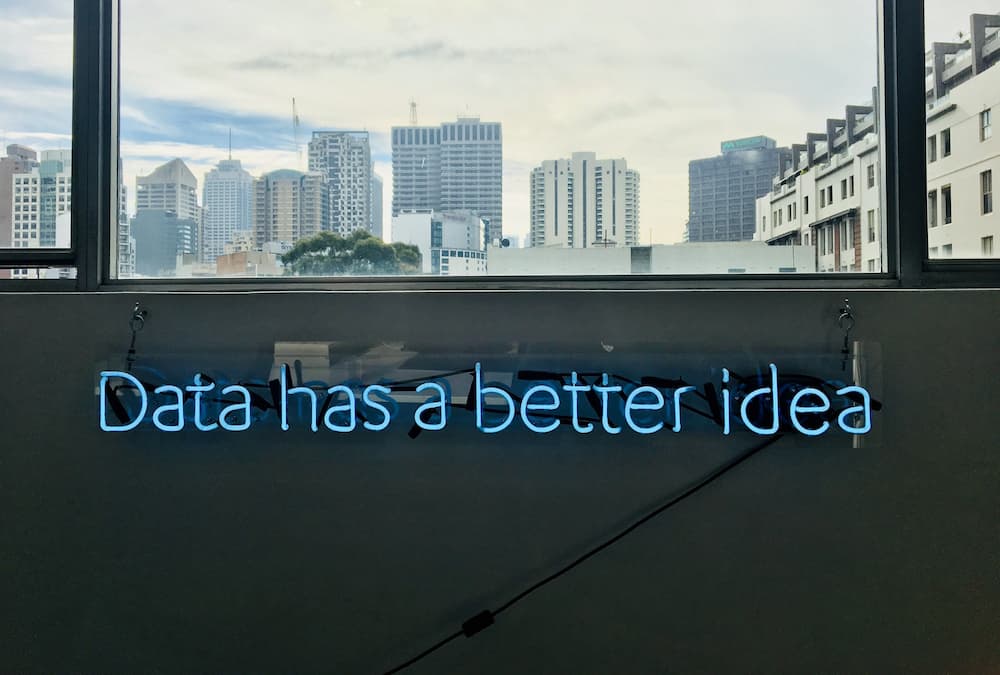 Neon quote spelling 'Data has a better idea' - What is data driven content marketing? - Copify blog